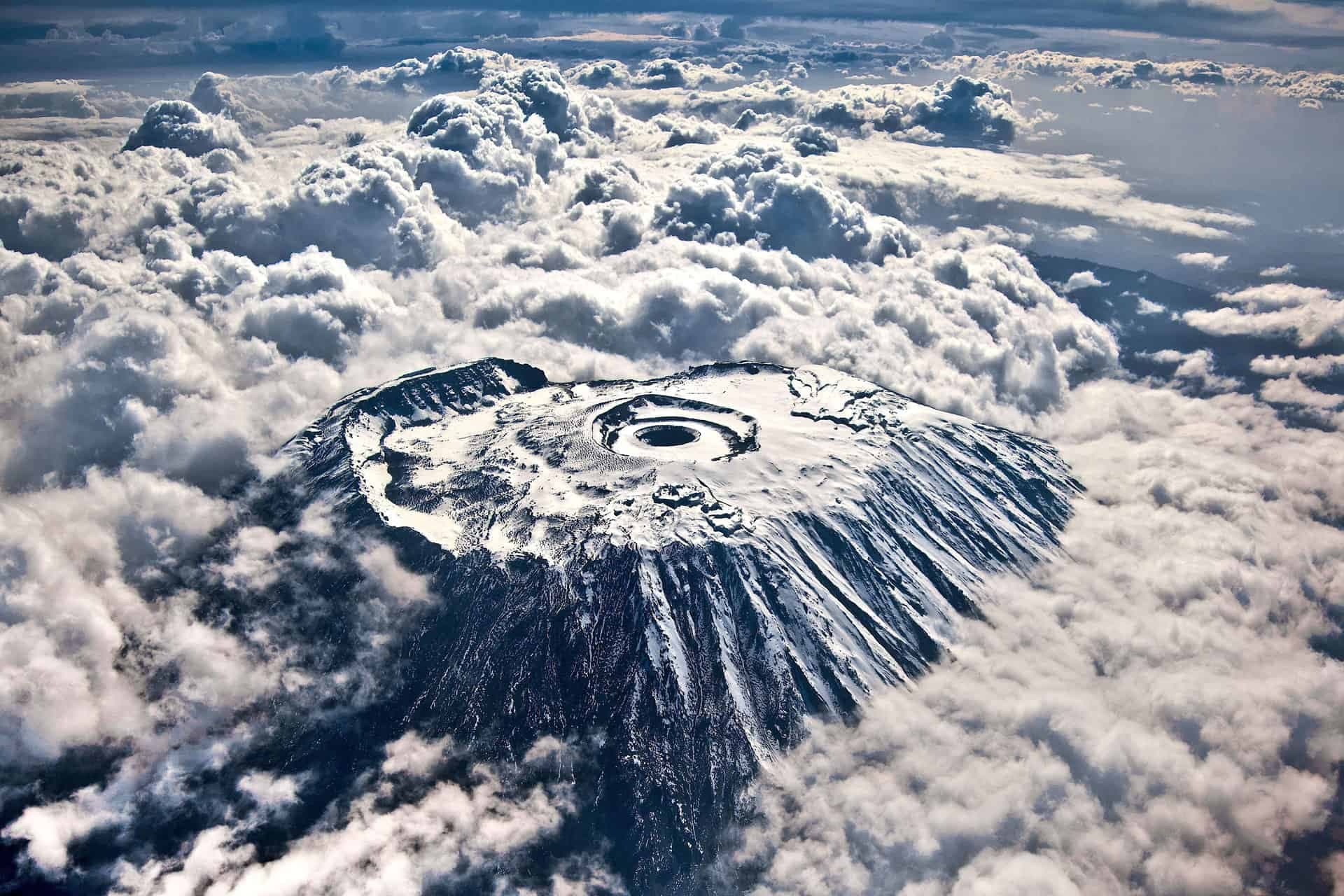 Group hiking high altitude trails in Kilimanjaro
