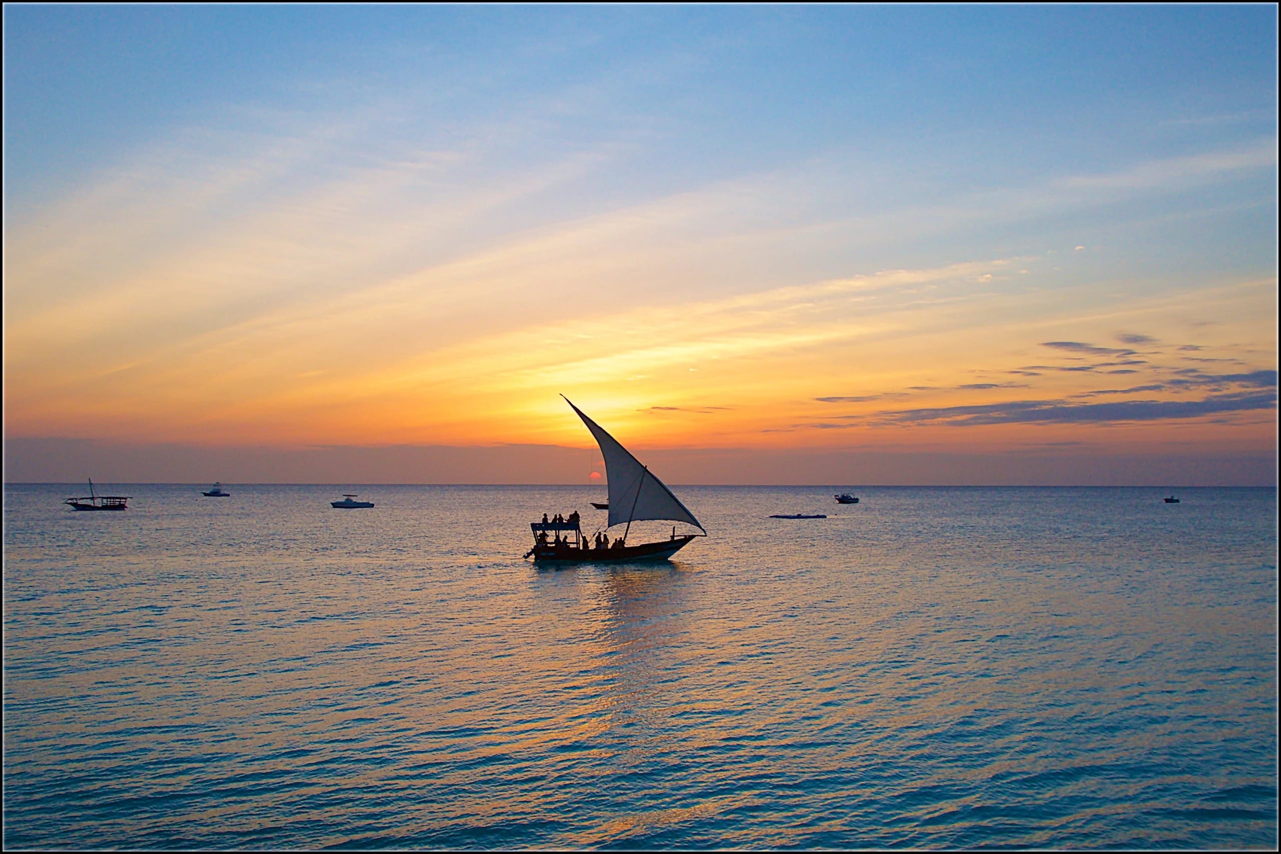 A dhow sailing off Zanzibar at sunset